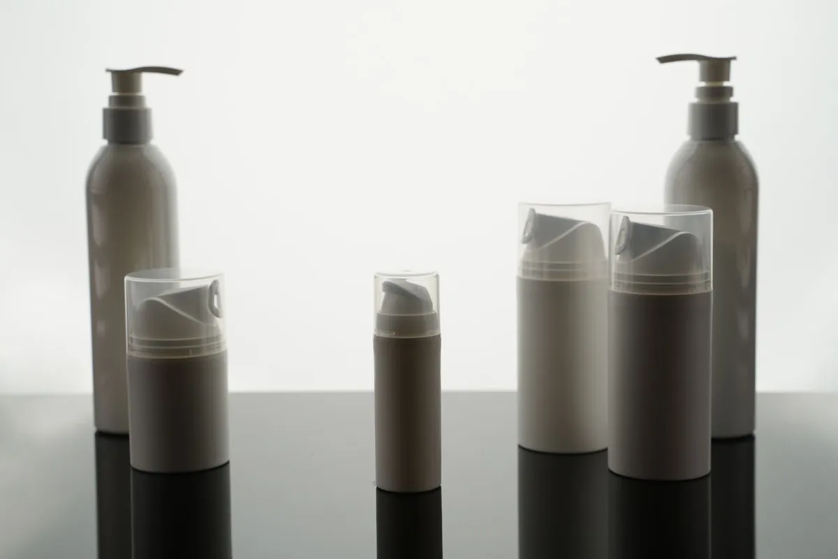 Stylish arrangement of empty bottles for product display in a minimalist style.